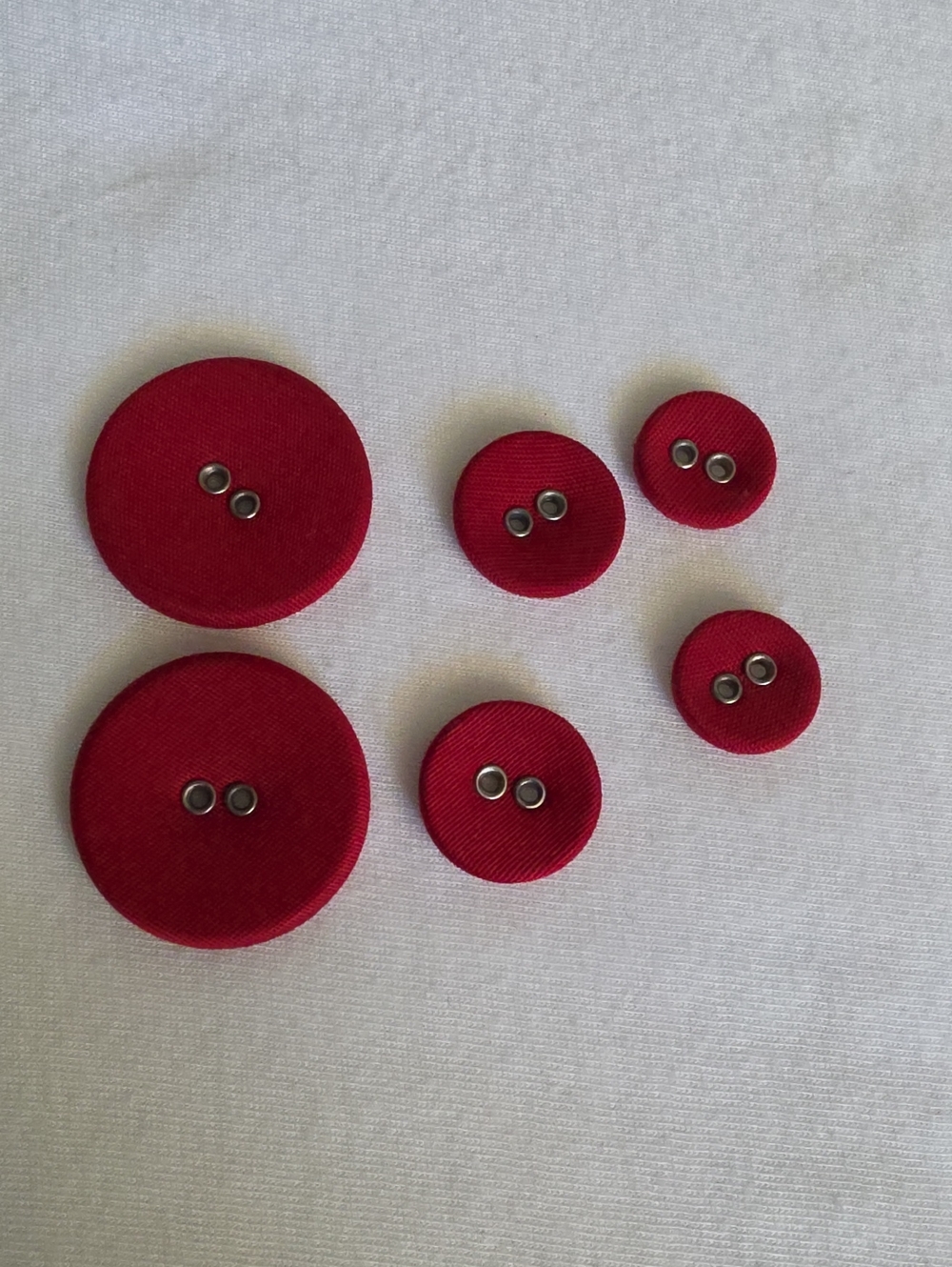 6  Vintage metal buttons covered with red fabric